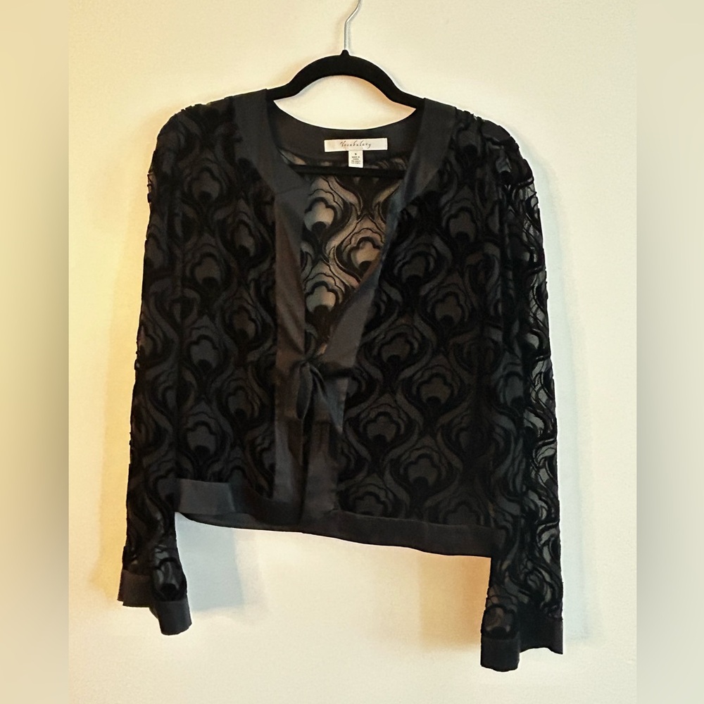 Black vocabulary blouse with silk detailing and bow